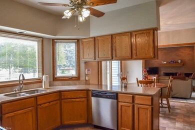 Large window above the sink overlooking the backya