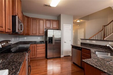 Spacious kitchen with SS appliances and granite co