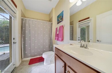 Bathroom featuring vanity, tile patterned floors,