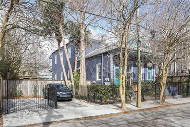 Exterior view of property w/ gated off-street park