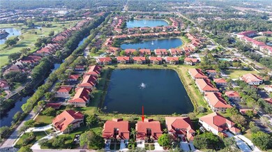 Aerial view featuring a water view and a residenti