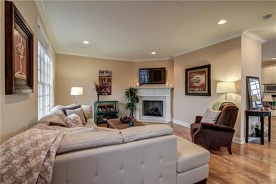 Large living rm with hardwood flrs, fireplace w/gas logs.