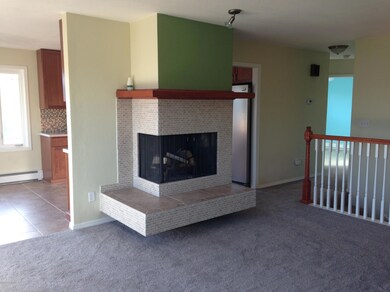 Newly tile faced corner fireplace
