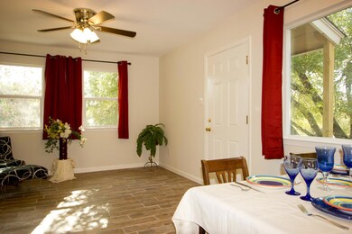 Dining area featuring baseboards, ceiling fan, an