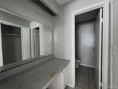 Bathroom with tile patterned flooring and vanity
