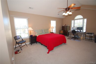 Massive master bedroom has Palladian window, ceili