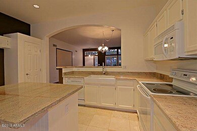 KITCHEN LOOKING INTO LIVING ROOM