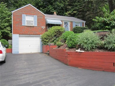 Exterior front with new asphalt driveway