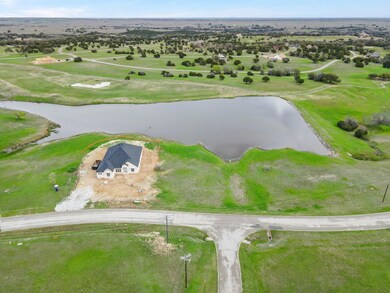 Bird's eye view with a water view and a rural view