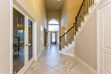 Photographed to the left is the study. You've got to love those graceful glass doors.