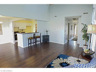 Living room looking into the dining area and kitch