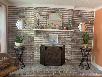 Gas Logs. Whitewashed Bricks to brighten up this l