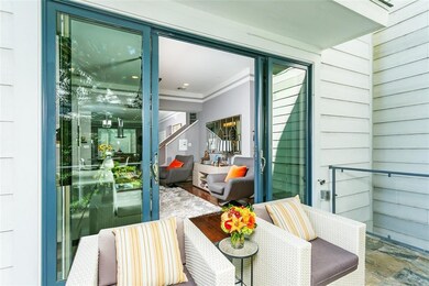 The second floor balcony is large and features sla