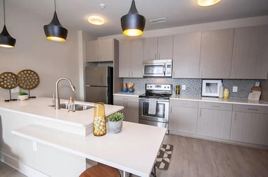 Kitchen featuring stainless steel appliances, sink