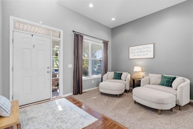 A sun-filled front porch welcomes you inside a spacious front entryway.