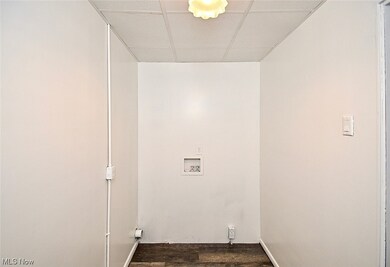 Laundry room featuring hookup for a washing machine and hardwood / wood-style flooring