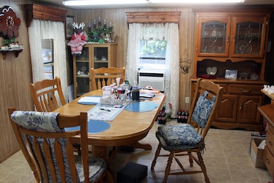 Dining room with wooden walls and cooling unit
