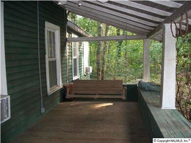 Un-screened part of front porch. Porch makes an 