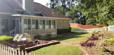 View of yard with a sunroom