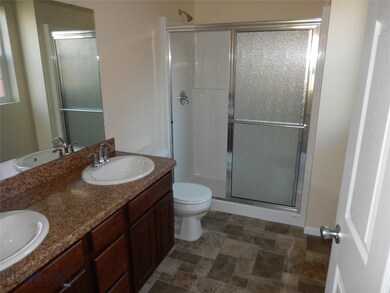 Master bathroom. Photo of similar home.