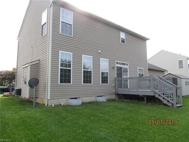 Nice flat back yard, and Trex deck for entertainin