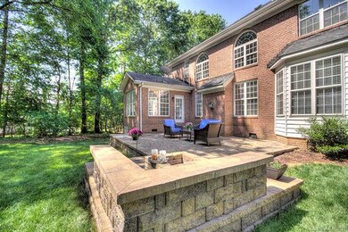 Fire pit with seating on the stone wall.