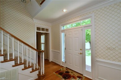Spacious foyer with a turned staircase says 'WELCOME'!