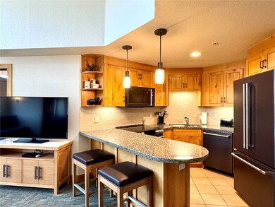 The granite countertop on the peninsula adds more