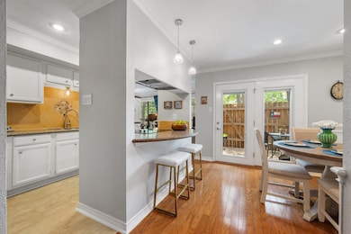 Kitchen featuring light wood-style floors, a sink