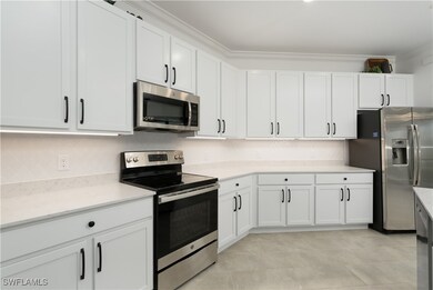 Kitchen with appliances with stainless steel finis