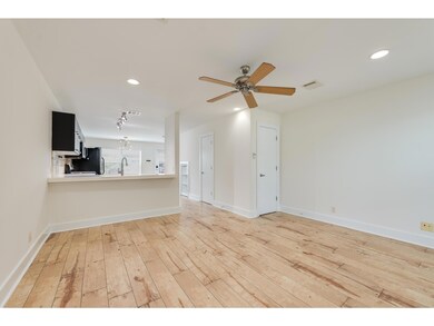 Unfurnished living room with light wood-type floo