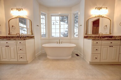 Bathroom featuring a tub to relax in and vanity