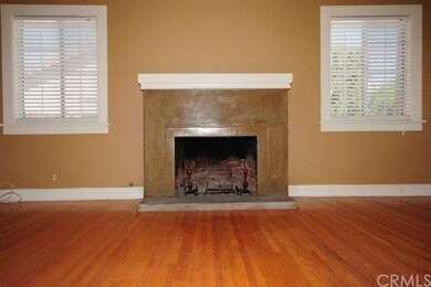 Wood burning fireplace in living room with gas lin