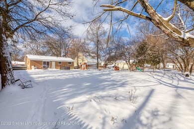 deep back yard partially fenced