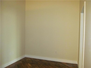 Bedroom. Den has white trim and neutral newly pain