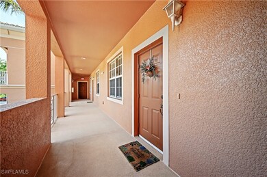 Doorway to property with stucco siding