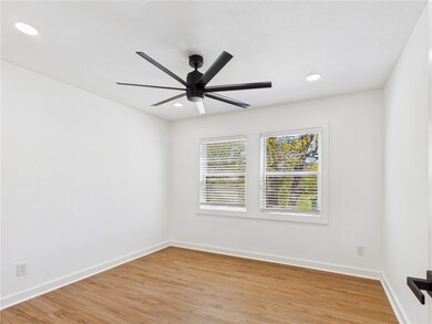 Empty room featuring light wood finished floors, b