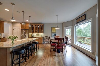 Kitchen, breakfast area and door to deck