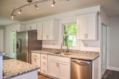 The kitchen has stainless steel appliances.