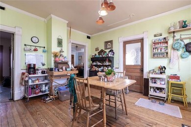 Open doorway toward middle leads to formal dinning