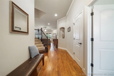 Gleaming hardwood floors stretch throughout the ma