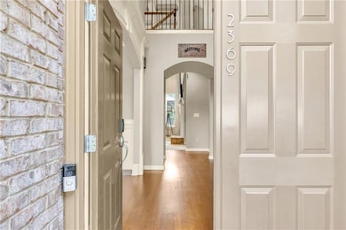 Entryway featuring wood finished floors, baseboard
