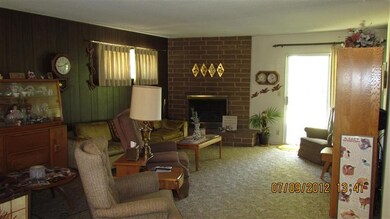 Large family room with brick fireplace with gas lo