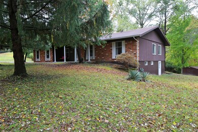 Brick on front and aluminum siding for low mainten