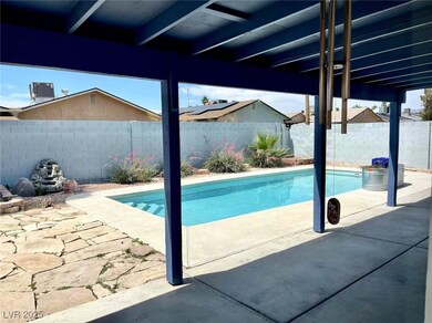 View of pool featuring a fenced backyard and a pat