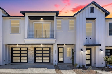 View of front facade with a balcony, board and ba