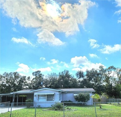 Ranch-style house with a front lawn