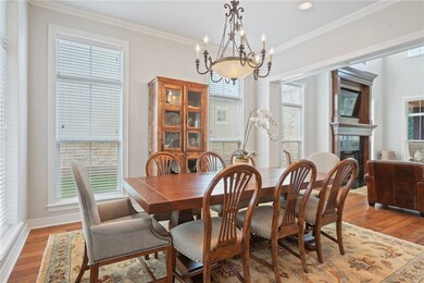 Dining area featuring a chandelier, light wood-typ