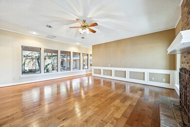Main living room has lots of natural light and views of the courtyard