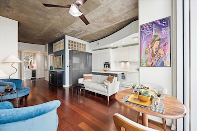 Living room with wine cooler, ceiling fan, dark w